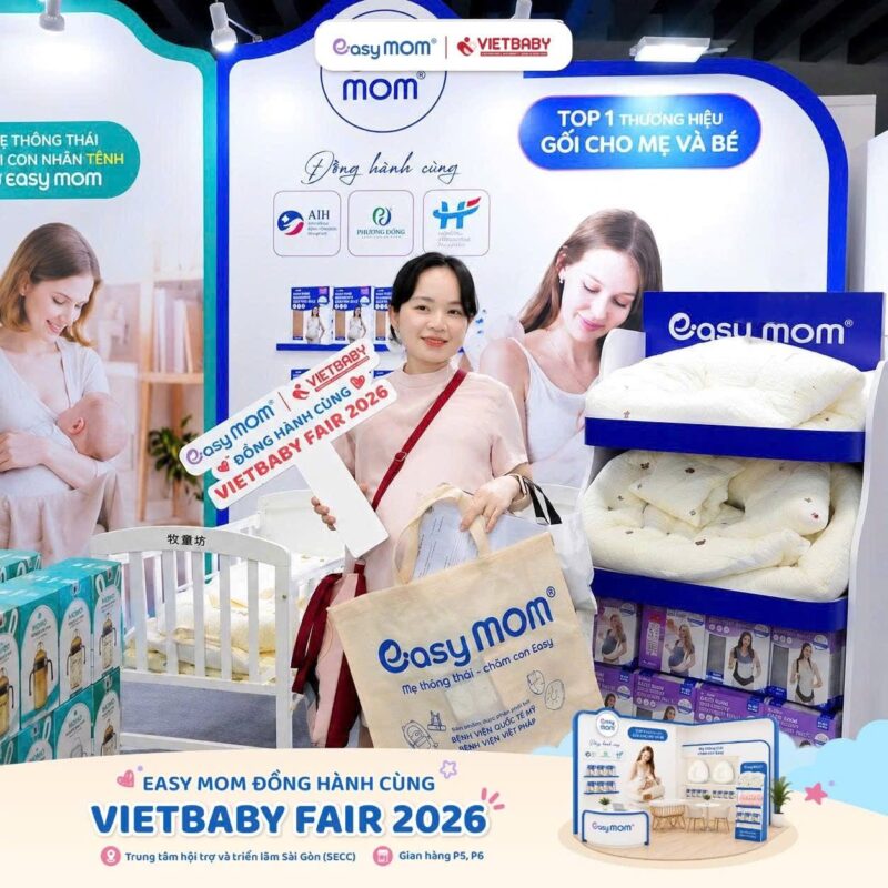 a woman standing in front of a display of baby products